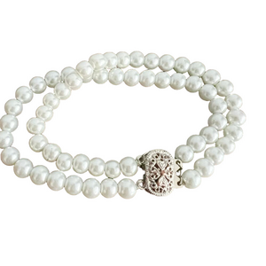 Vintage double strand pearl bracelet with silver tone fish hook clasp
